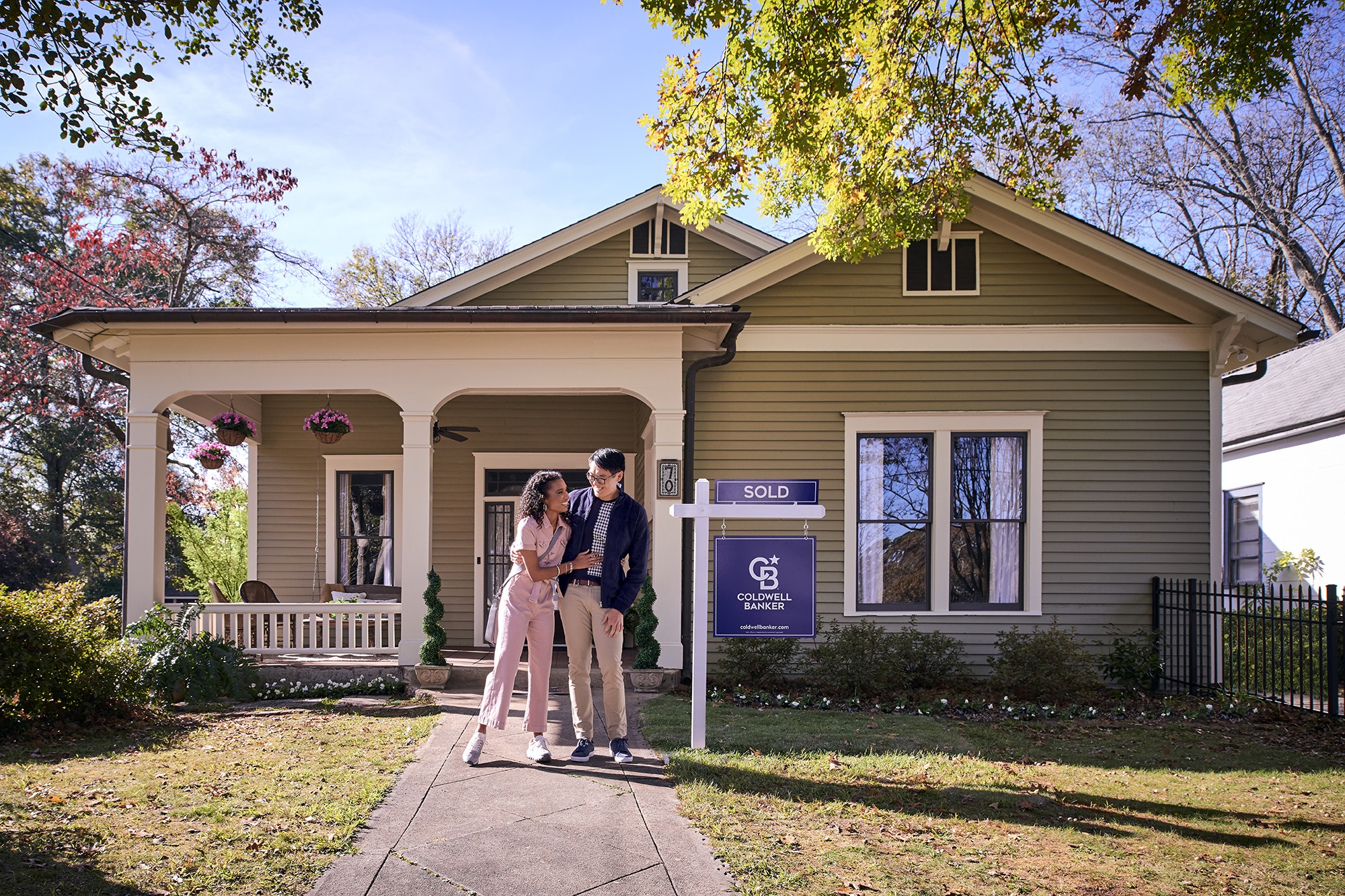 couple outside sold home